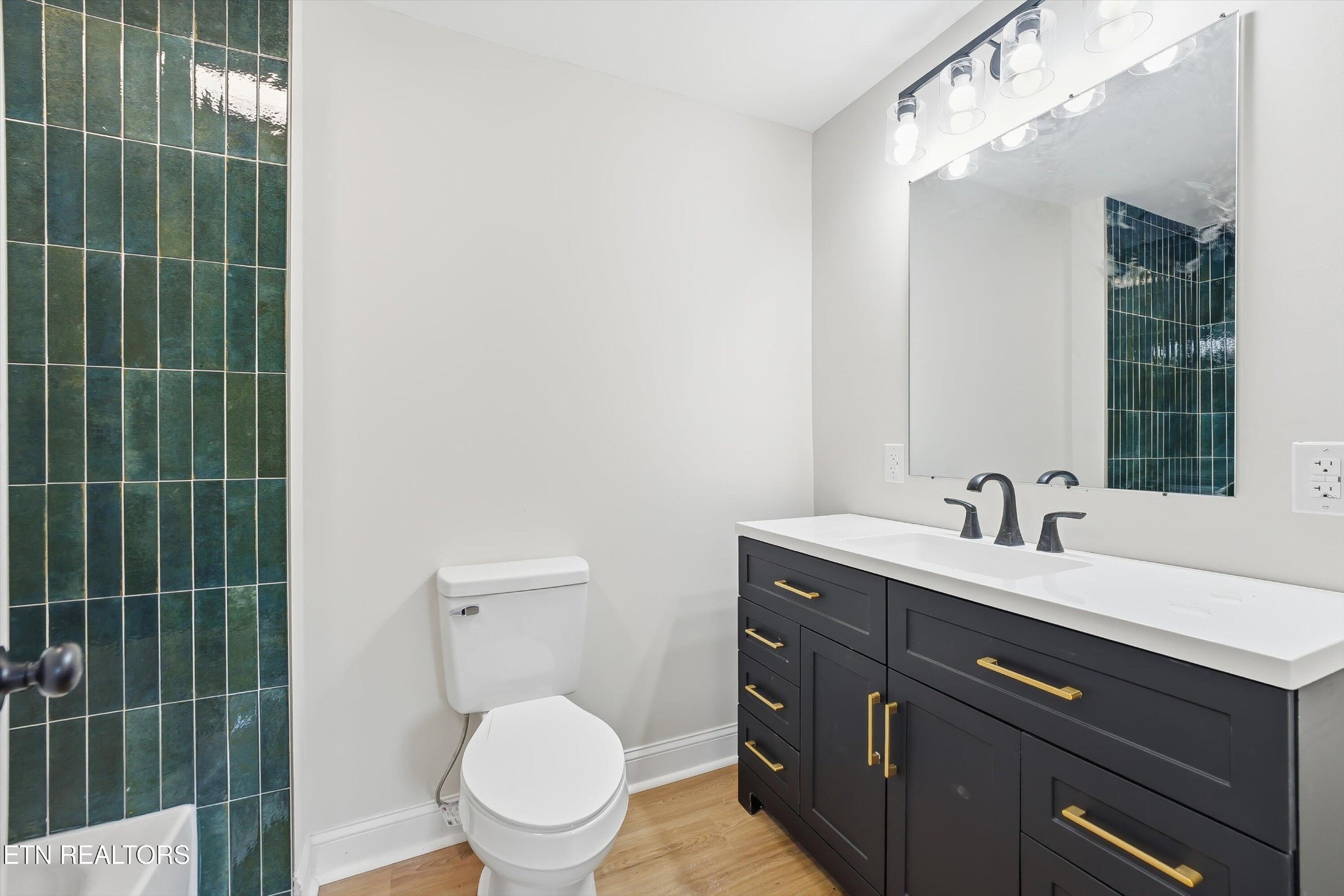 567 Dogwood Road Rockwood, TN 37854 - Photo 19 of 48 a bathroom with a toilet a sink and mirror