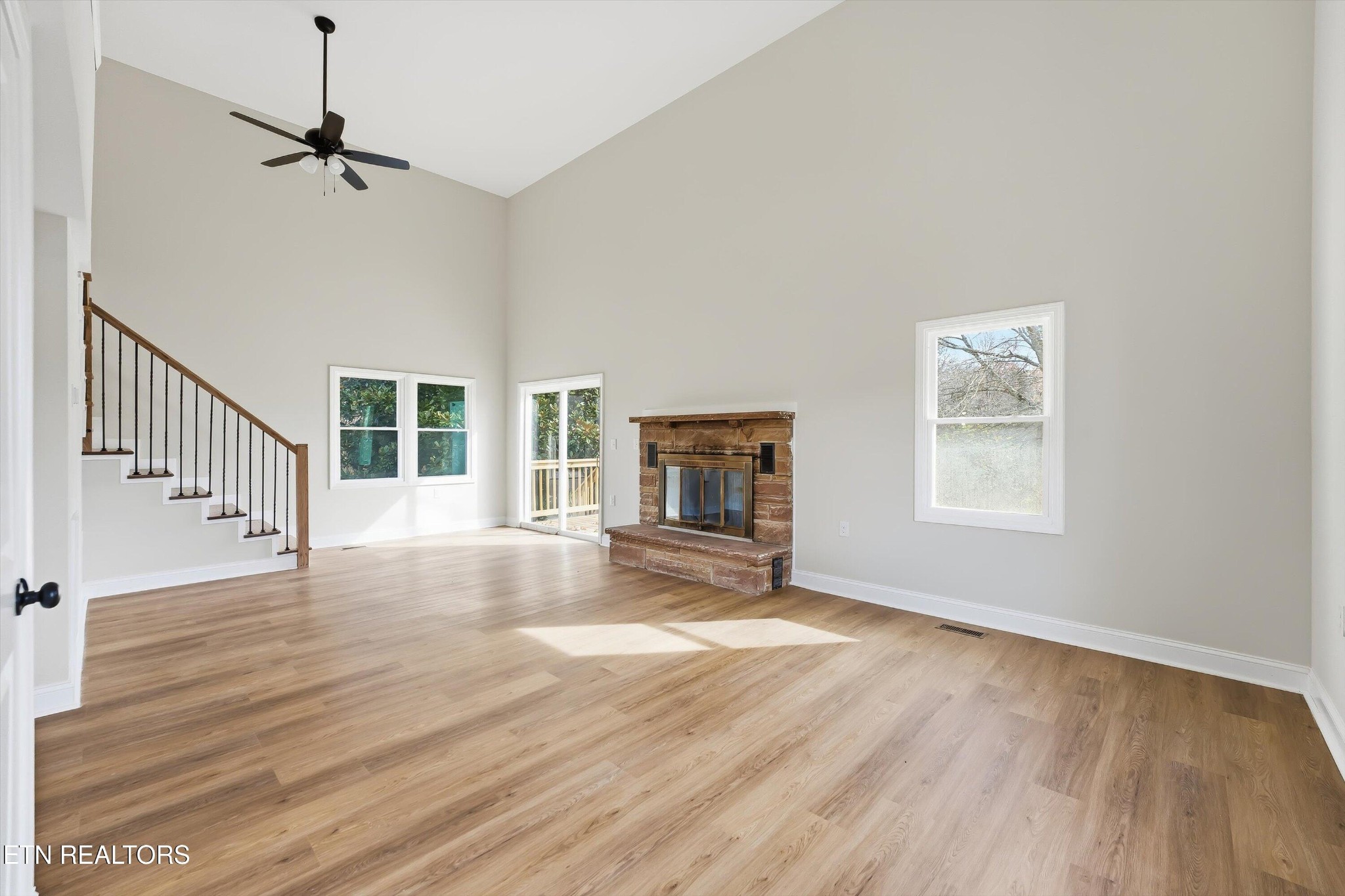567 Dogwood Road Rockwood, TN 37854 - Photo 5 of 48 a view of an empty room with wooden floor fireplace and a window