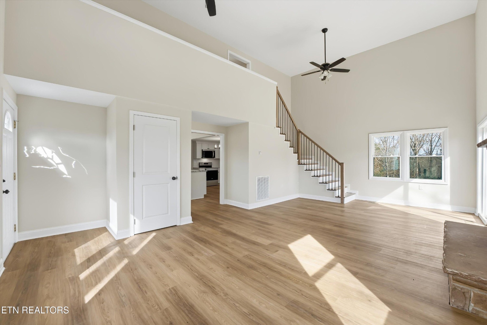 567 Dogwood Road Rockwood, TN 37854 - Photo 6 of 48 a view of an empty room with wooden floor and a window