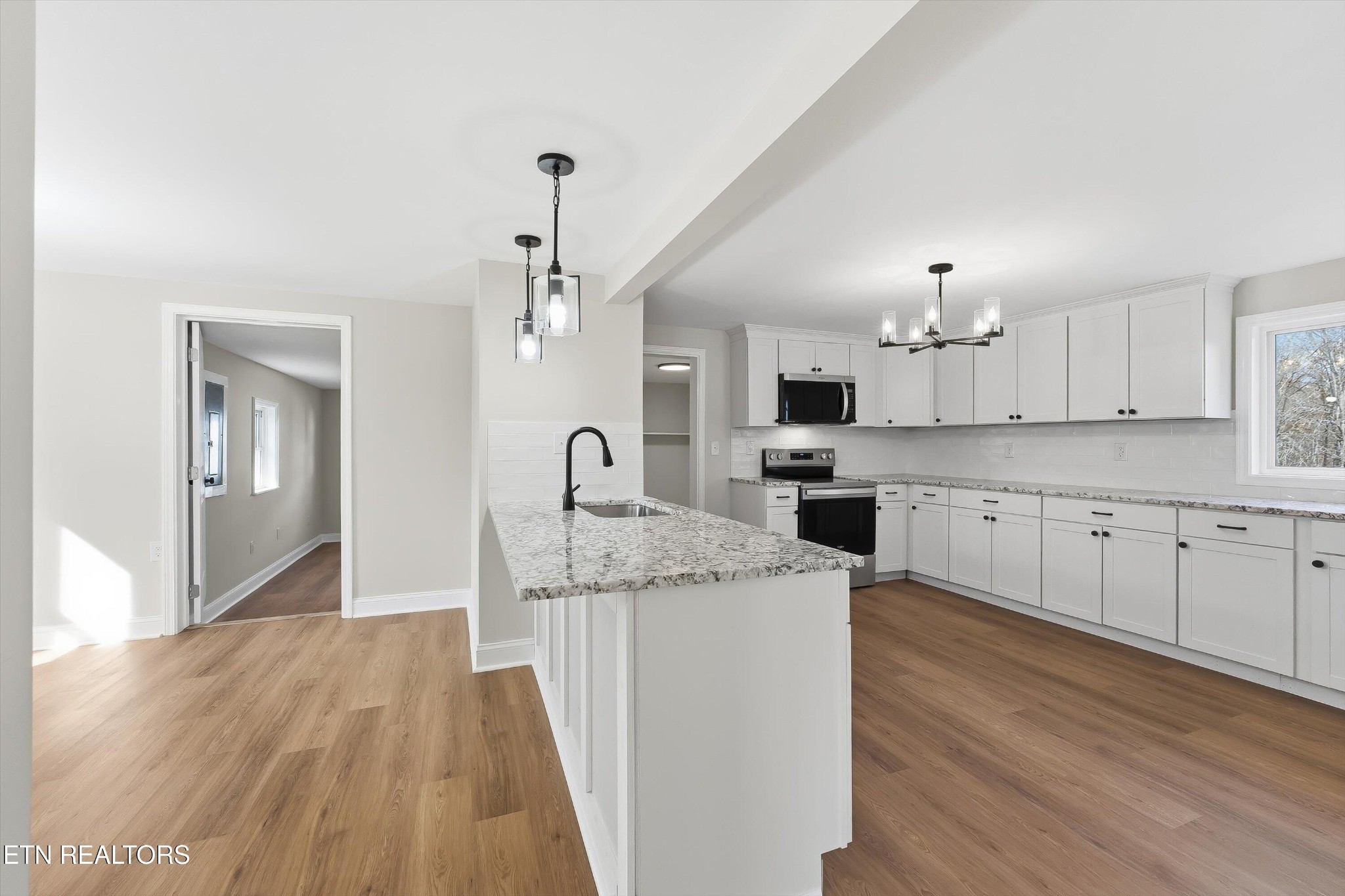 567 Dogwood Road Rockwood, TN 37854 - Photo 9 of 48 a kitchen with stainless steel appliances kitchen island granite countertop a sink and cabinets