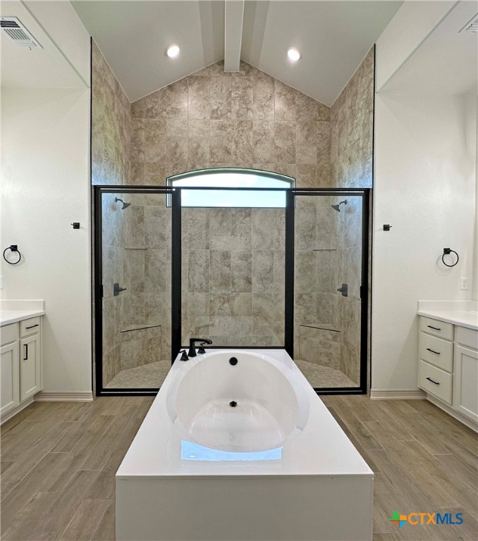 4521 Agave Trail Temple, TX 76502 - Photo 12 of 25 a bathroom with a tub a sink and glass door shower