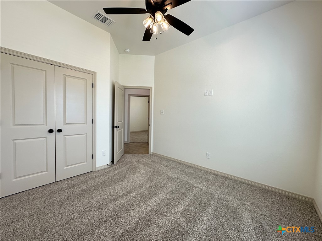 4521 Agave Trail Temple, TX 76502 - Photo 19 of 25 a view of an empty room and chandelier fan