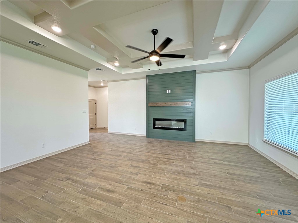 4521 Agave Trail Temple, TX 76502 - Photo 2 of 25 a view of empty room with wooden floor and ceiling fan