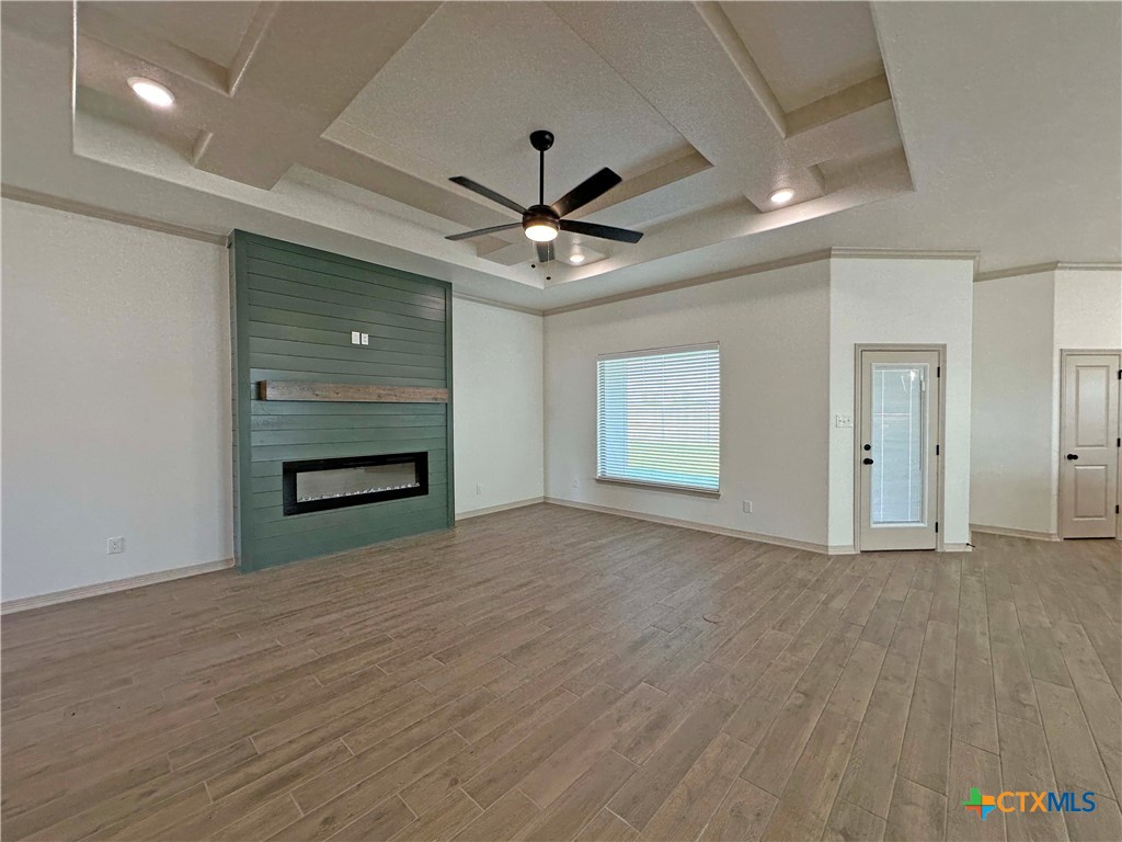 4521 Agave Trail Temple, TX 76502 - Photo 3 of 25 a view of an empty room with a ceiling fan window and cabinet
