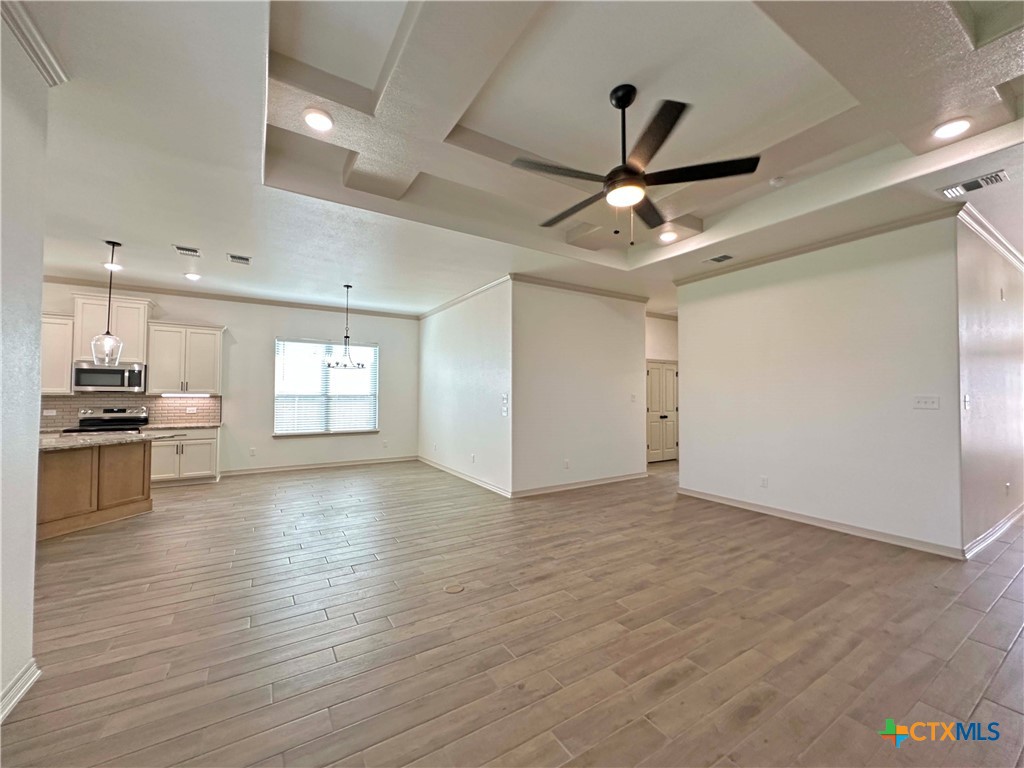 4521 Agave Trail Temple, TX 76502 - Photo 5 of 25 a view of empty room with wooden floor and ceiling fan