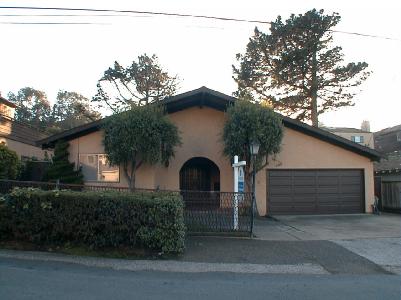 a front view of a house with garage and garage