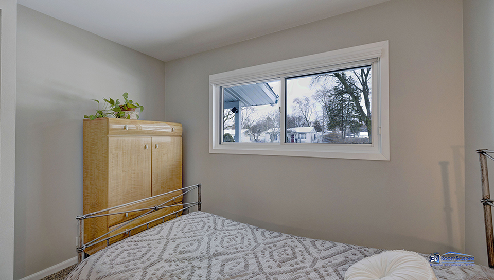 348 Raupp Boulevard Buffalo Grove, IL 60089 - Photo 15 of 41 a bedroom with a bed and a window