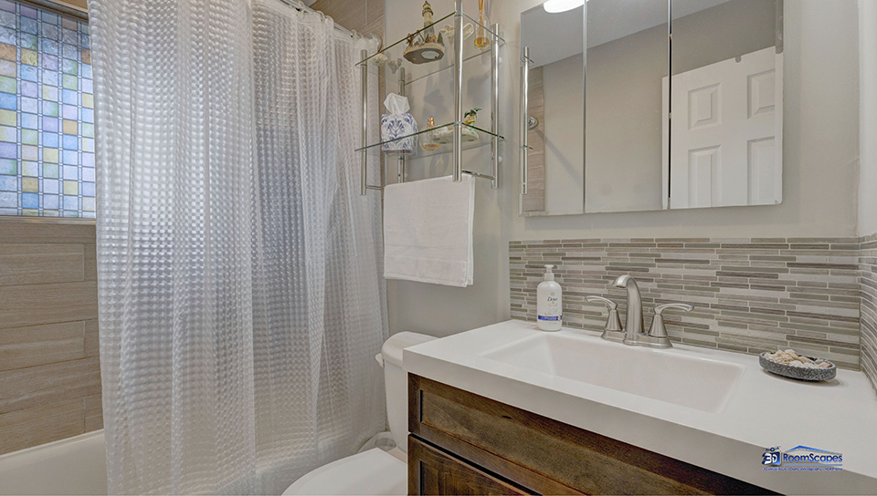 348 Raupp Boulevard Buffalo Grove, IL 60089 - Photo 16 of 41 a bathroom with a sink and a shower