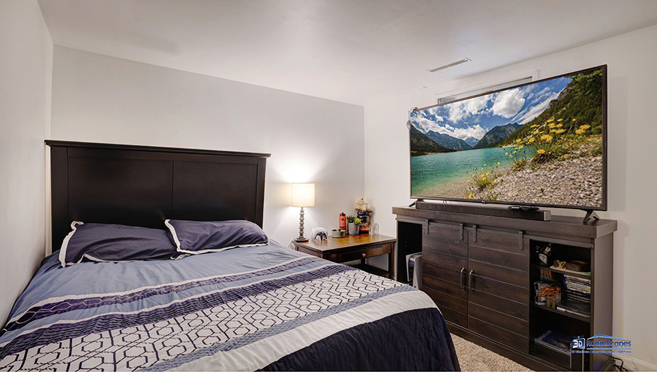 348 Raupp Boulevard Buffalo Grove, IL 60089 - Photo 22 of 41 a bedroom with a bed and a flat tv screen on dresser