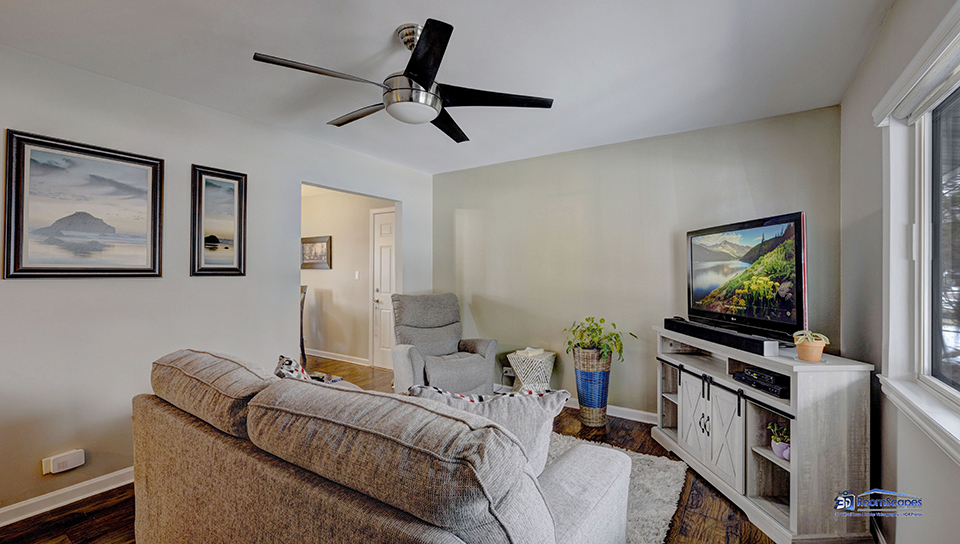 348 Raupp Boulevard Buffalo Grove, IL 60089 - Photo 3 of 41 a living room with furniture and a flat screen tv