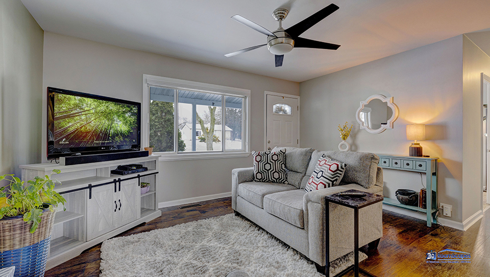 348 Raupp Boulevard Buffalo Grove, IL 60089 - Photo 5 of 41 a living room with furniture and a flat screen tv