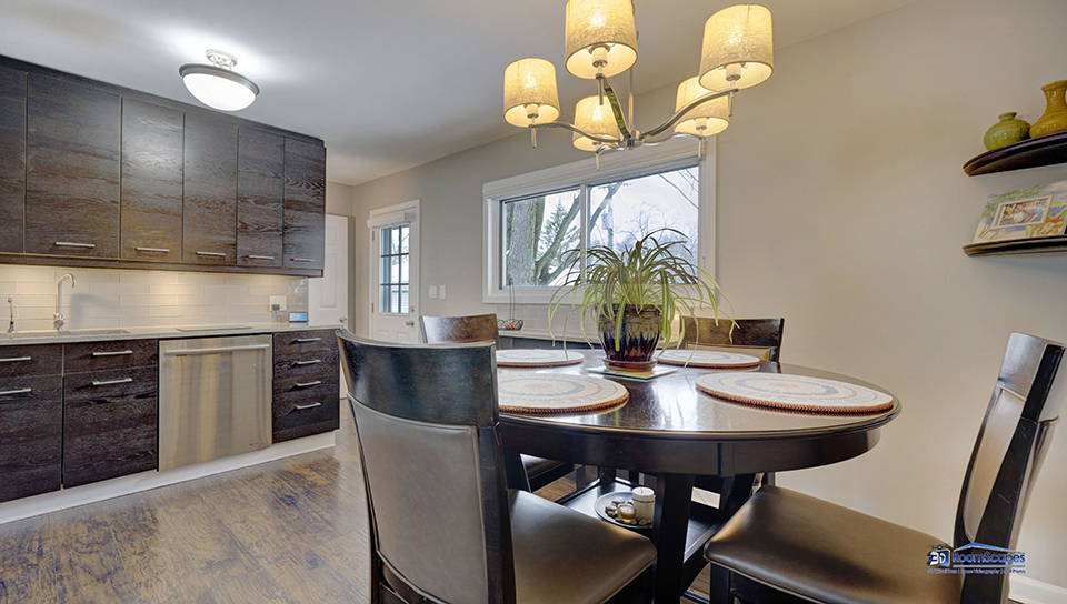 348 Raupp Boulevard Buffalo Grove, IL 60089 - Photo 8 of 41 a kitchen with a dining table chairs and chandelier