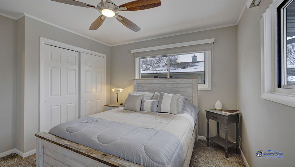 348 Raupp Boulevard Buffalo Grove, IL 60089 - Photo 10 of 41 a bedroom with a bed and a chandelier