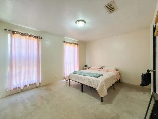 a kitchen with stainless steel appliances granite countertop a refrigerator sink and wooden cabinets