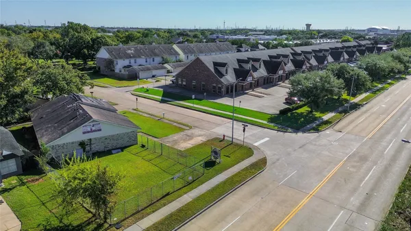 an aerial view of a house with a yard