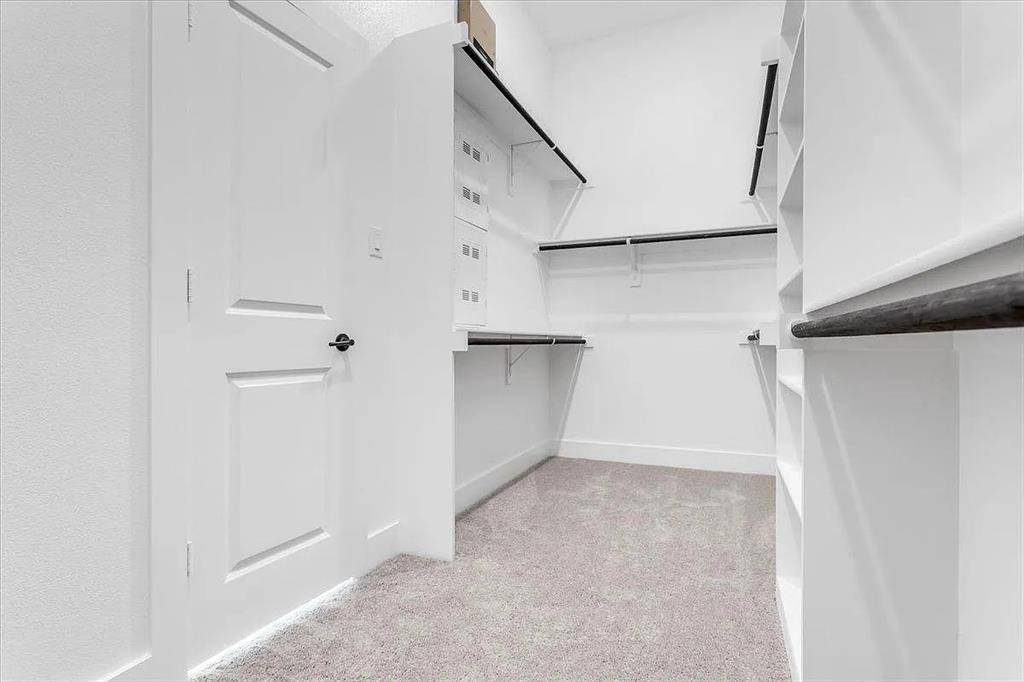 6246 Shasta Creek Road Celina, TX 75009 - Photo 16 of 24 a view of walk in closet with empty racks