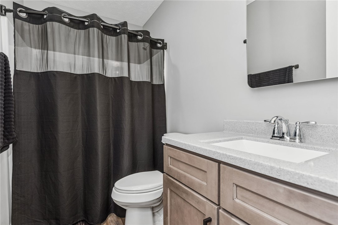 1602 Westboro Road Blanchester, OH 45107 - Photo 22 of 81 This clean bathroom features a modern vanity with sleek fixtures.