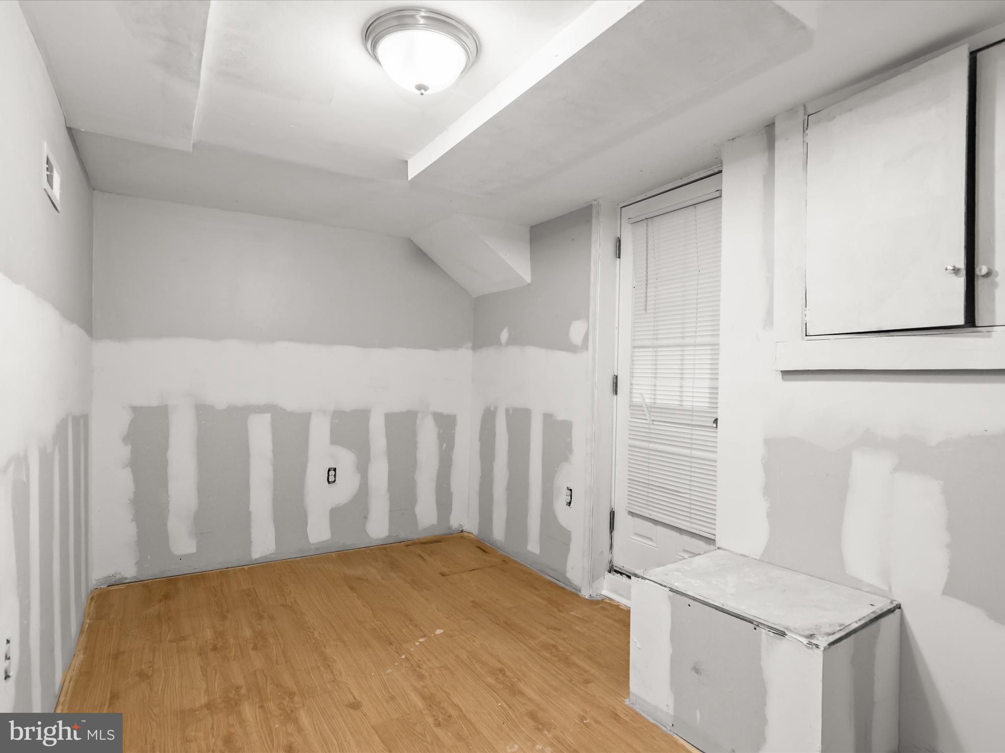 8351 Edgedale Road Baltimore, MD 21234 - Photo 14 of 22 a bedroom with a bed and a stove