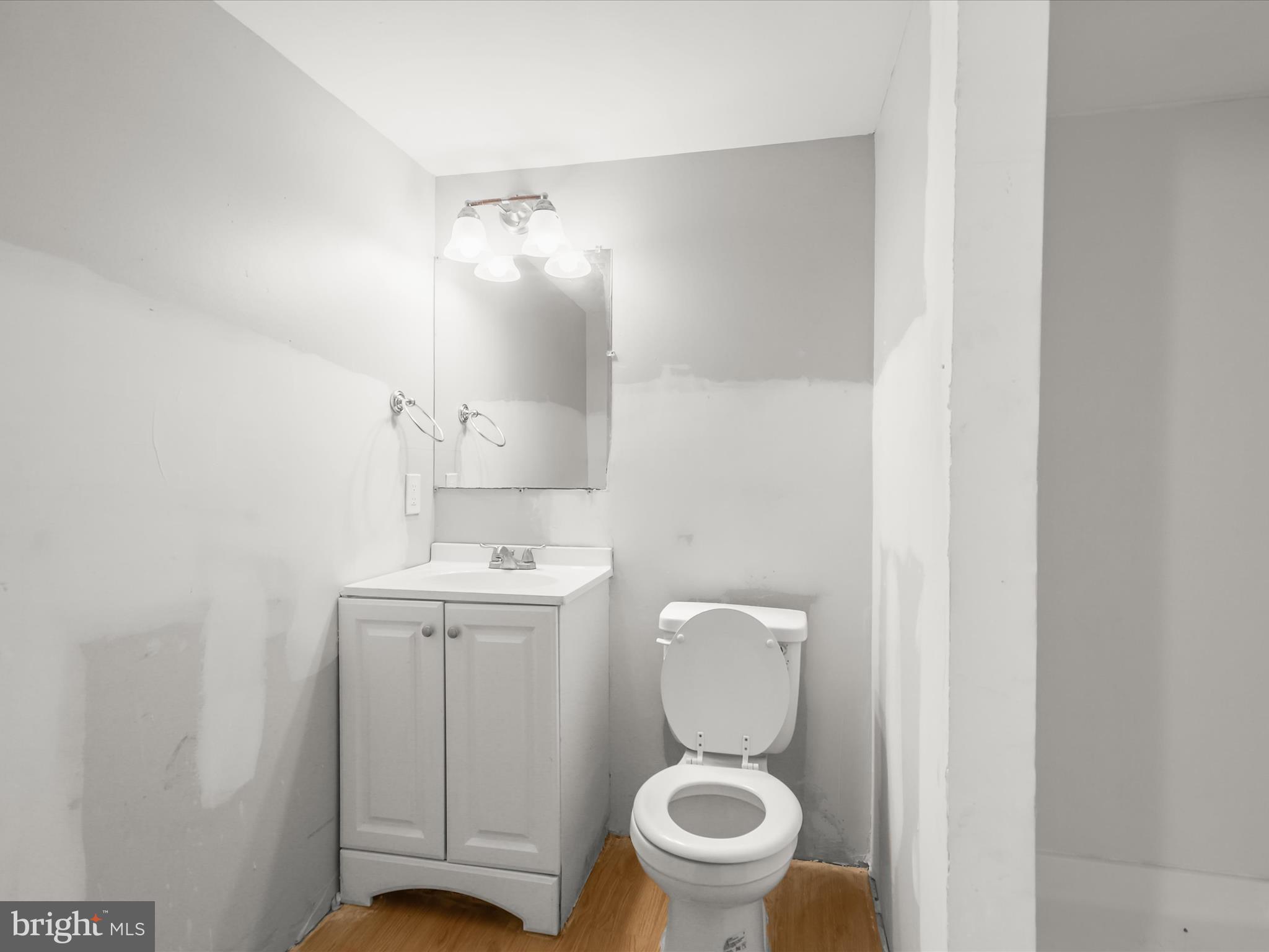 8351 Edgedale Road Baltimore, MD 21234 - Photo 16 of 22 a bathroom with a toilet sink and mirror