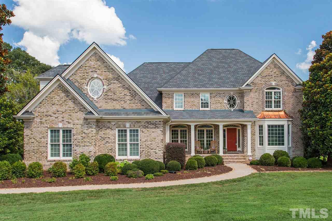 12404 Bayleaf Church Road Raleigh, NC 27614 - Photo 1 of 25 front view of a house with a yard
