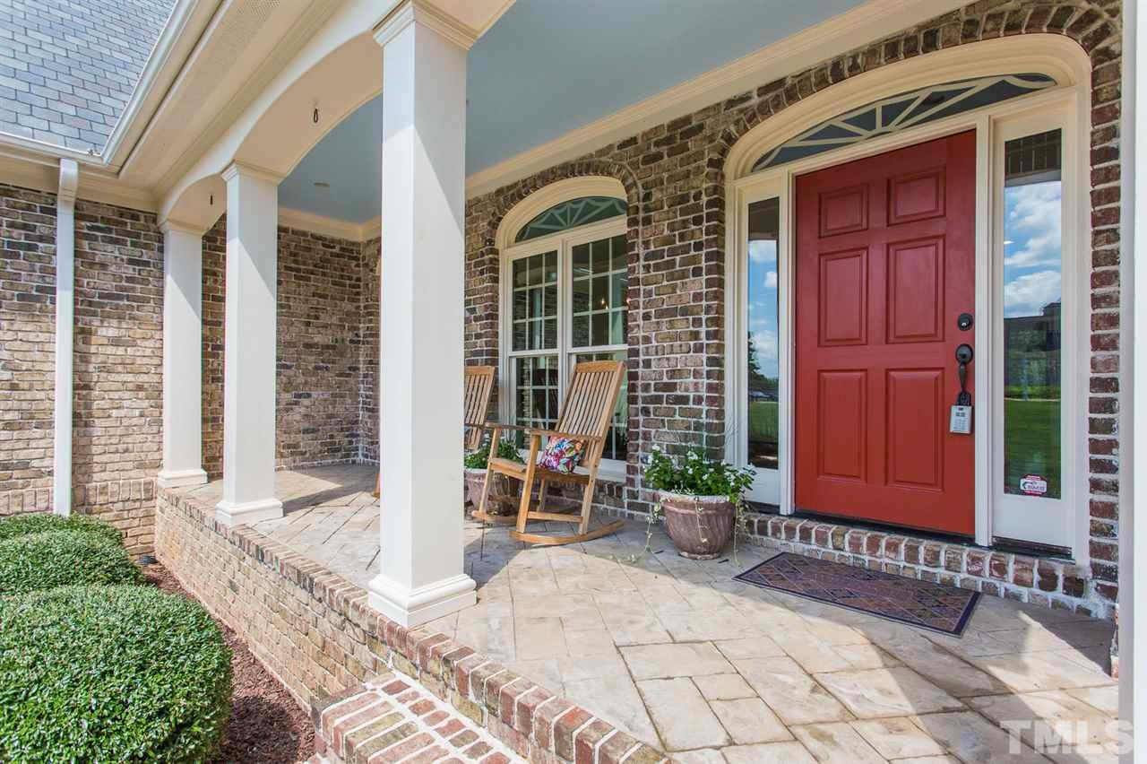 12404 Bayleaf Church Road Raleigh, NC 27614 - Photo 2 of 25 a front view of a house with outdoor seating