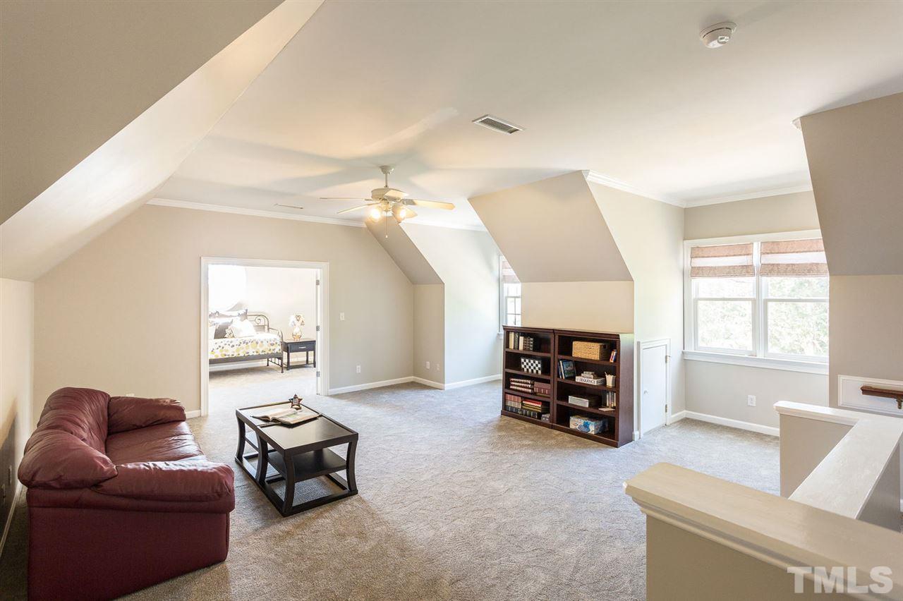 12404 Bayleaf Church Road Raleigh, NC 27614 - Photo 16 of 25 a living room with furniture and a window