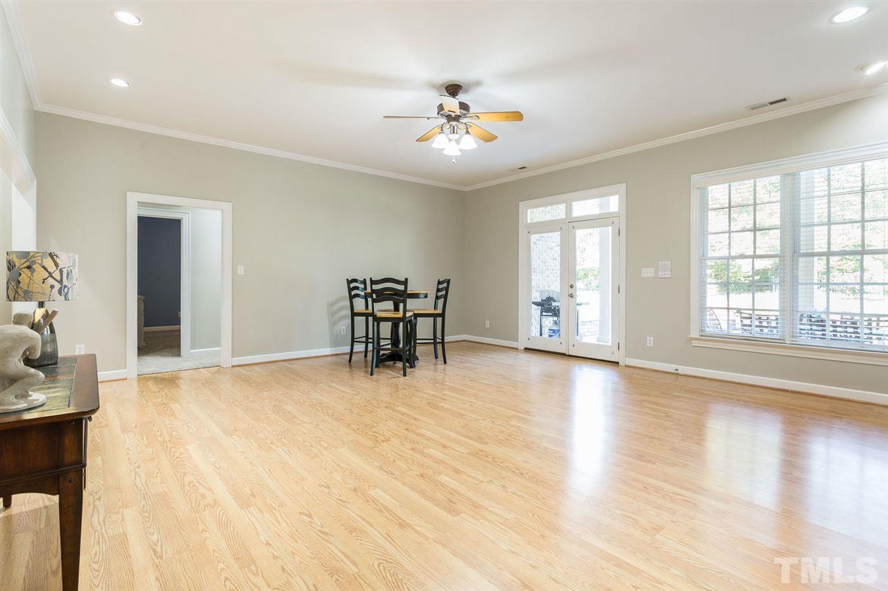 12404 Bayleaf Church Road Raleigh, NC 27614 - Photo 18 of 25 a view of an empty room with window and wooden floor