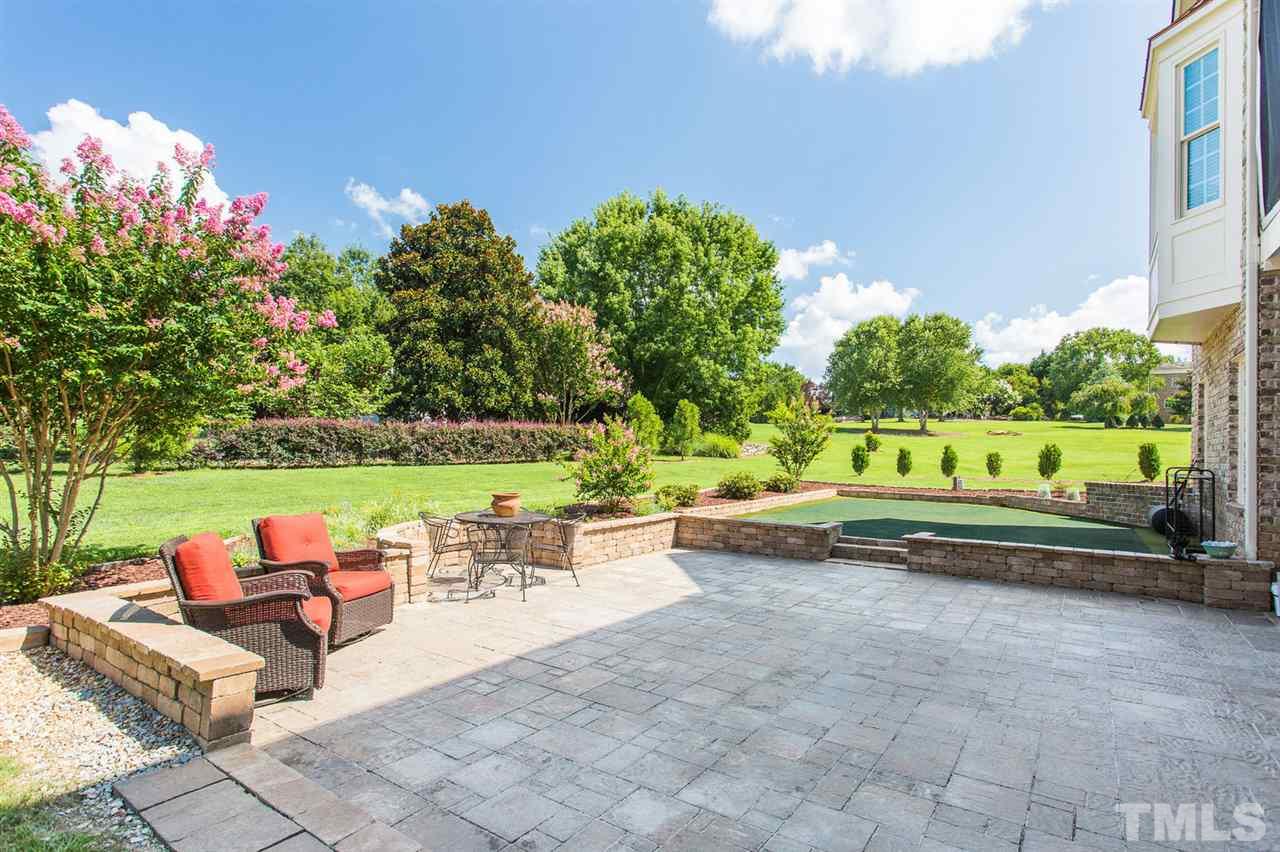 12404 Bayleaf Church Road Raleigh, NC 27614 - Photo 23 of 25 a view of a garden with sitting area