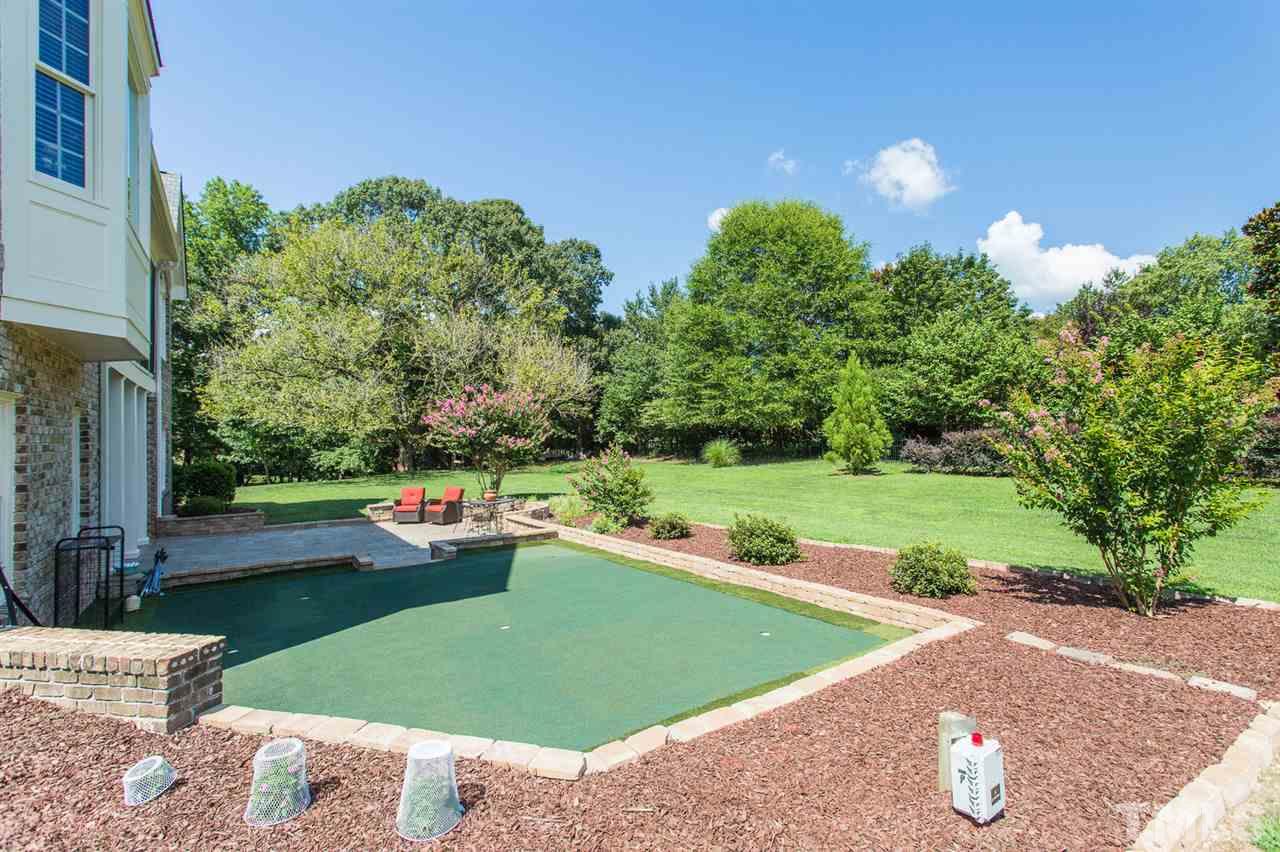12404 Bayleaf Church Road Raleigh, NC 27614 - Photo 25 of 25 a view of a garden with lawn chairs