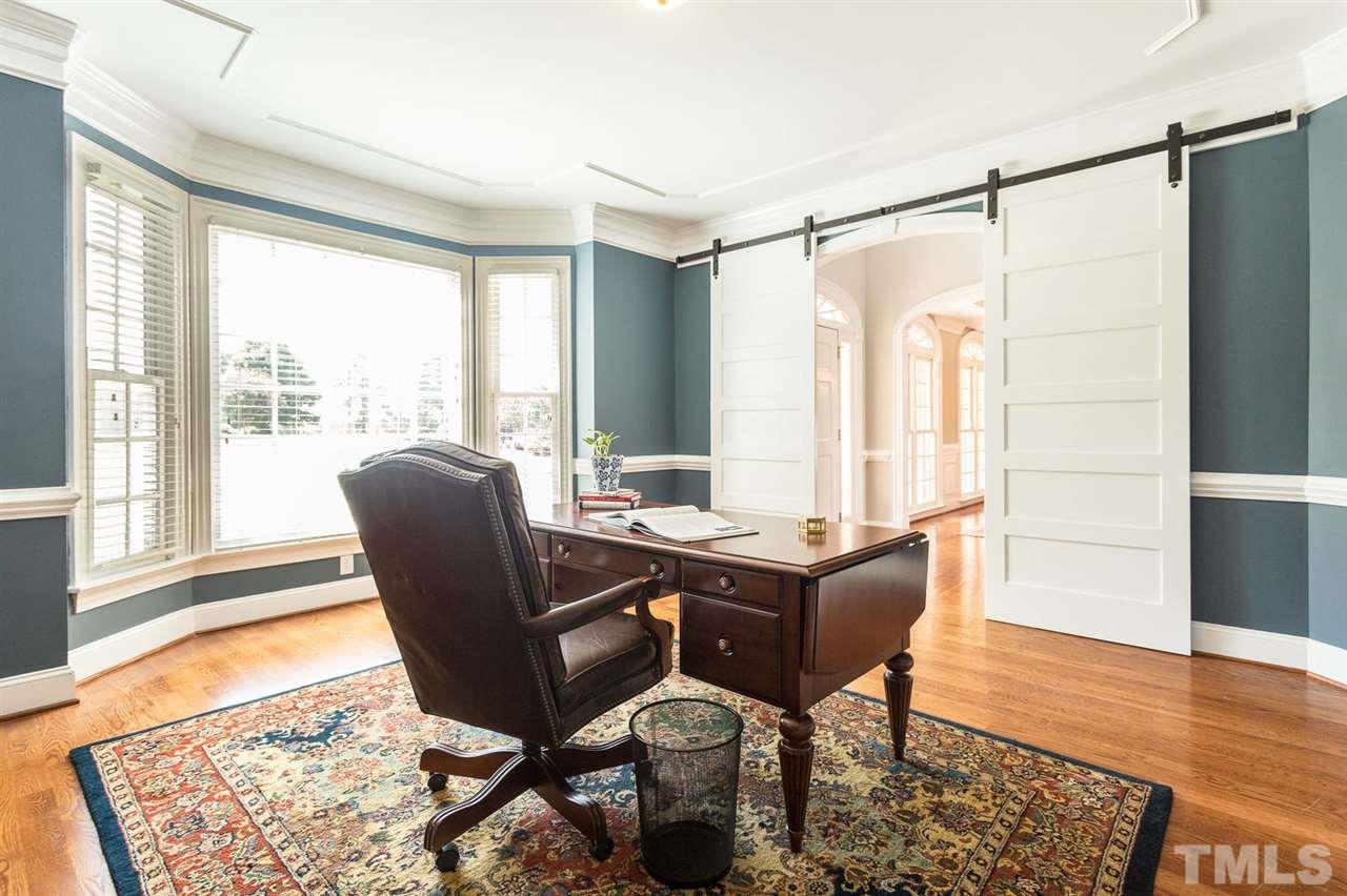 12404 Bayleaf Church Road Raleigh, NC 27614 - Photo 5 of 25 a view of a workspace with furniture and a window