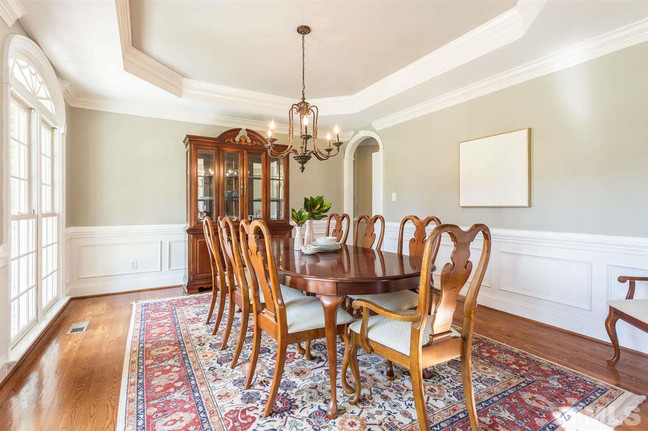 12404 Bayleaf Church Road Raleigh, NC 27614 - Photo 7 of 25 a view of a dining room with furniture window and wooden floor
