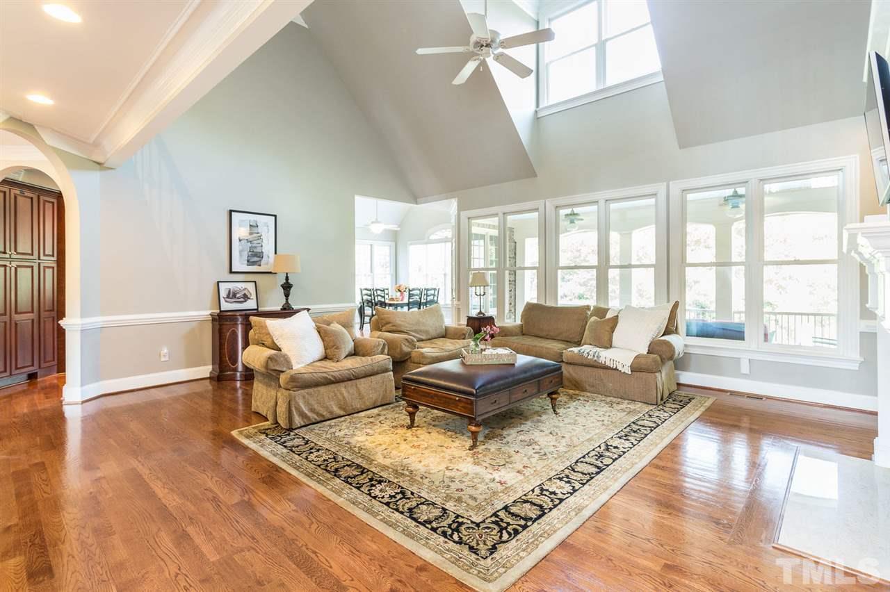 12404 Bayleaf Church Road Raleigh, NC 27614 - Photo 8 of 25 a living room with furniture a rug and a large window