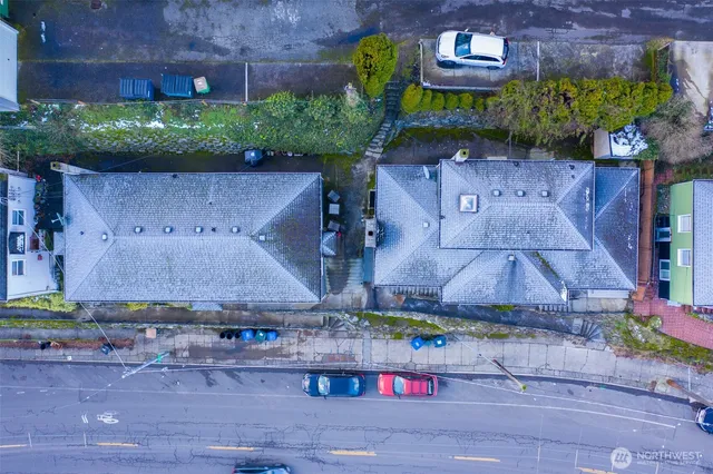 an aerial view of a house with a yard