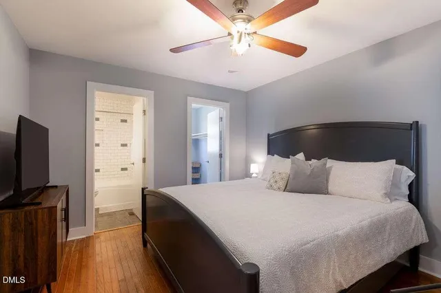 a bathroom with a sink toilet vanity and shower