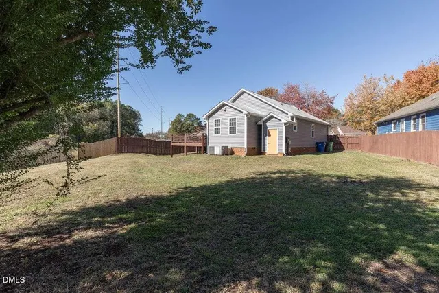 a view of house with yard and entertaining space