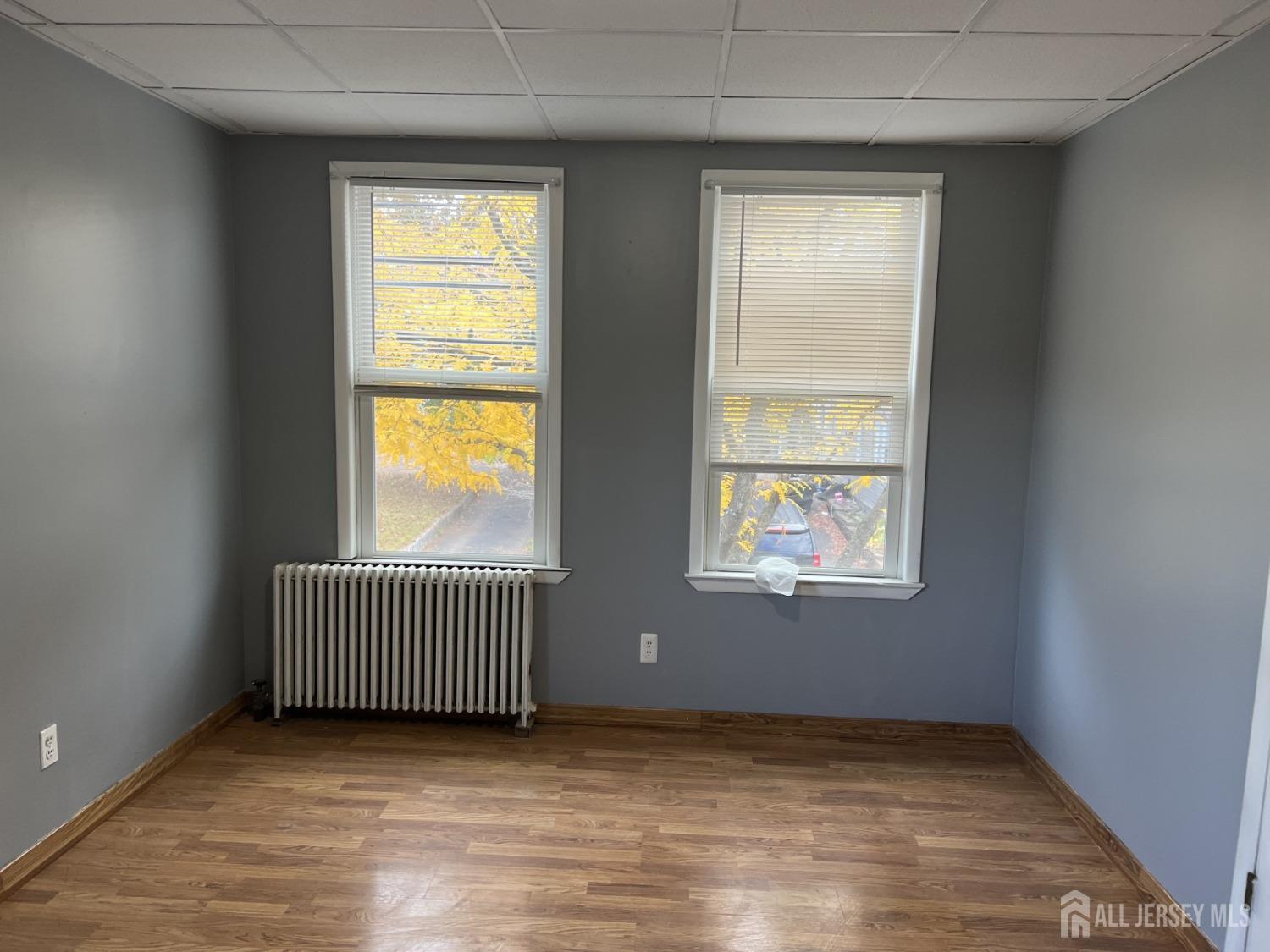 247 Washington Avenue, Unit 2F Carteret, NJ 07008 - Photo 2 of 10 an empty room with windows