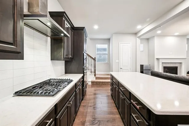 a kitchen with a stove and a sink