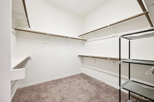 a bathroom with a shower sink and mirror