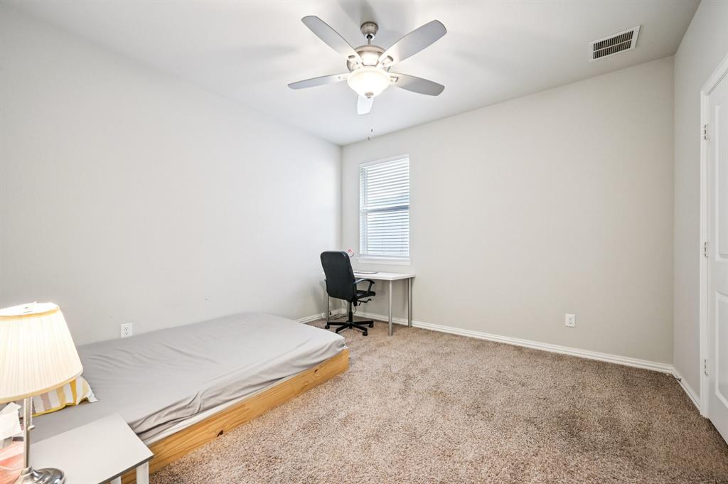 8039 Copper Way Dallas, TX 75252 - Photo 25 of 30 a living room with a couch and a chandelier