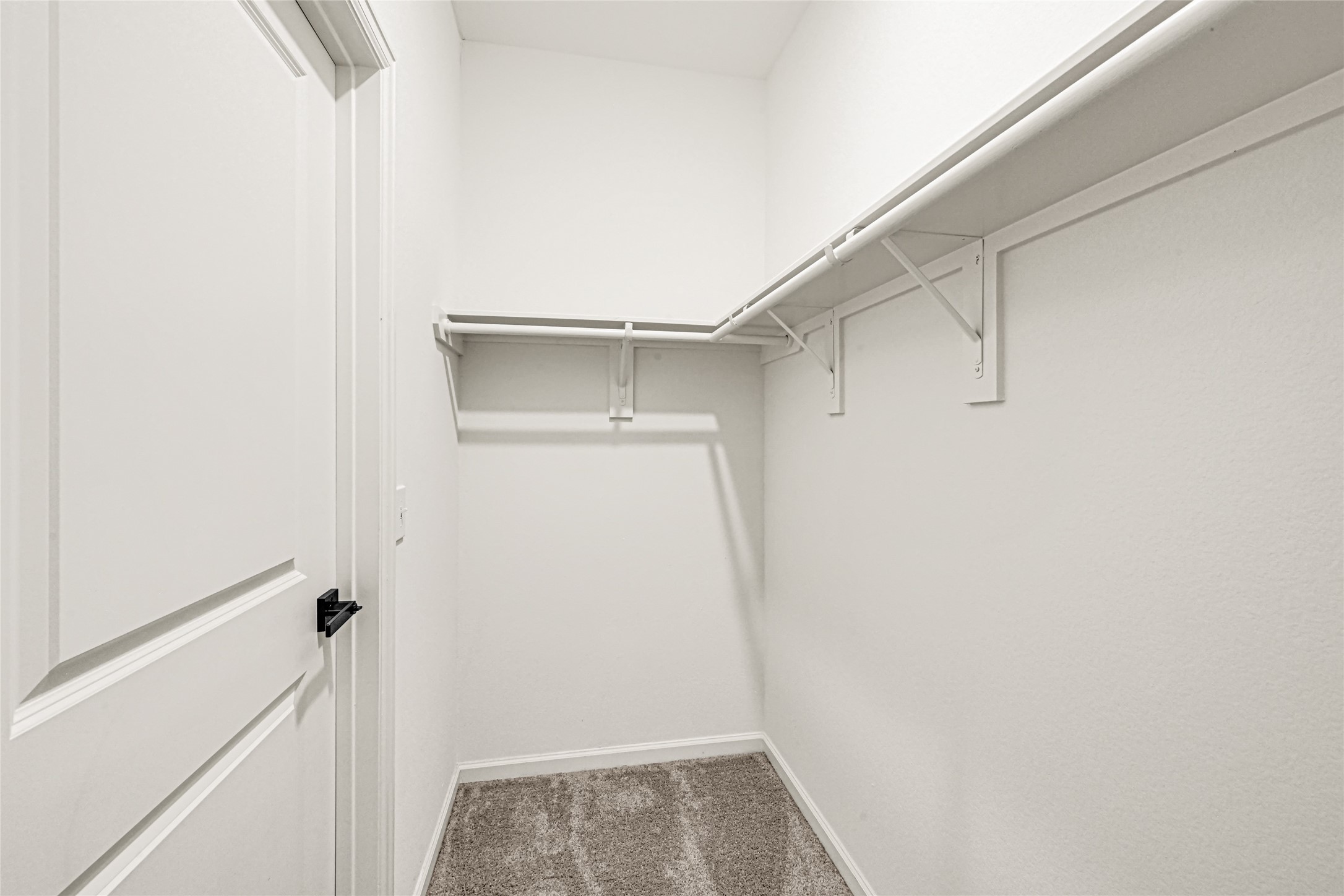 7311 Roseshine Drive Houston, TX 77049 - Photo 18 of 26 Spacious walk-in closet with built-in shelving and hanging space.