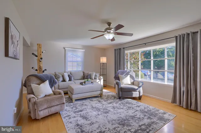 a living room with furniture and a rug