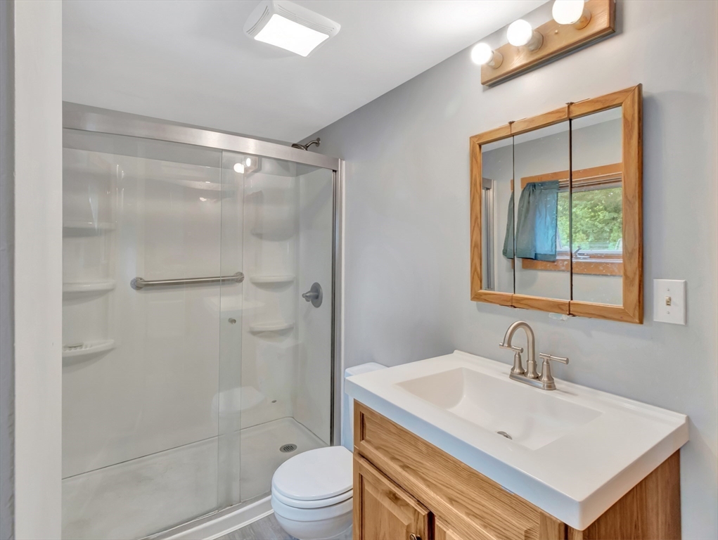 10 Ridge Road Norton, MA 02766 - Photo 12 of 34 a bathroom with a sink toilet and shower