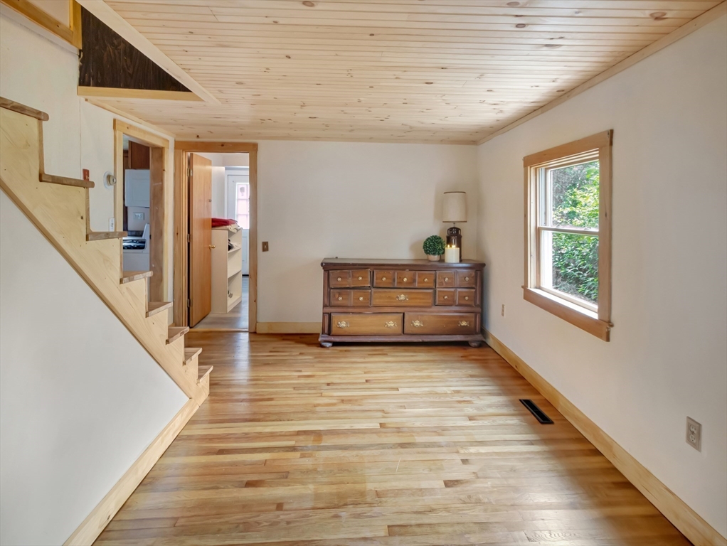 10 Ridge Road Norton, MA 02766 - Photo 18 of 34 a view of hallway with stairs and wooden floor