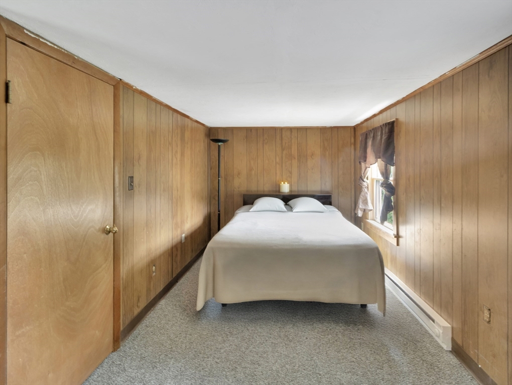 10 Ridge Road Norton, MA 02766 - Photo 23 of 34 a bedroom with a bed and a large window