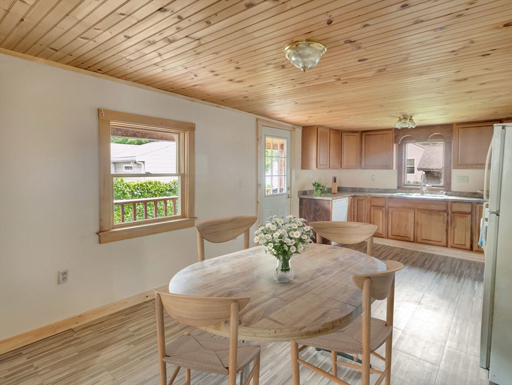 10 Ridge Road Norton, MA 02766 - Photo 10 of 34 a kitchen with a table chairs and refrigerator