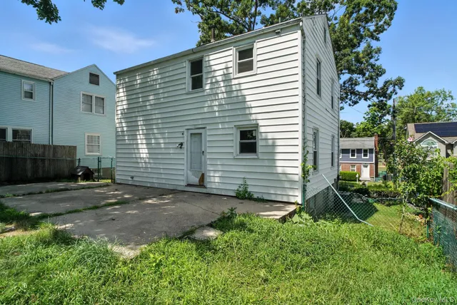 a view of a back yard of the house