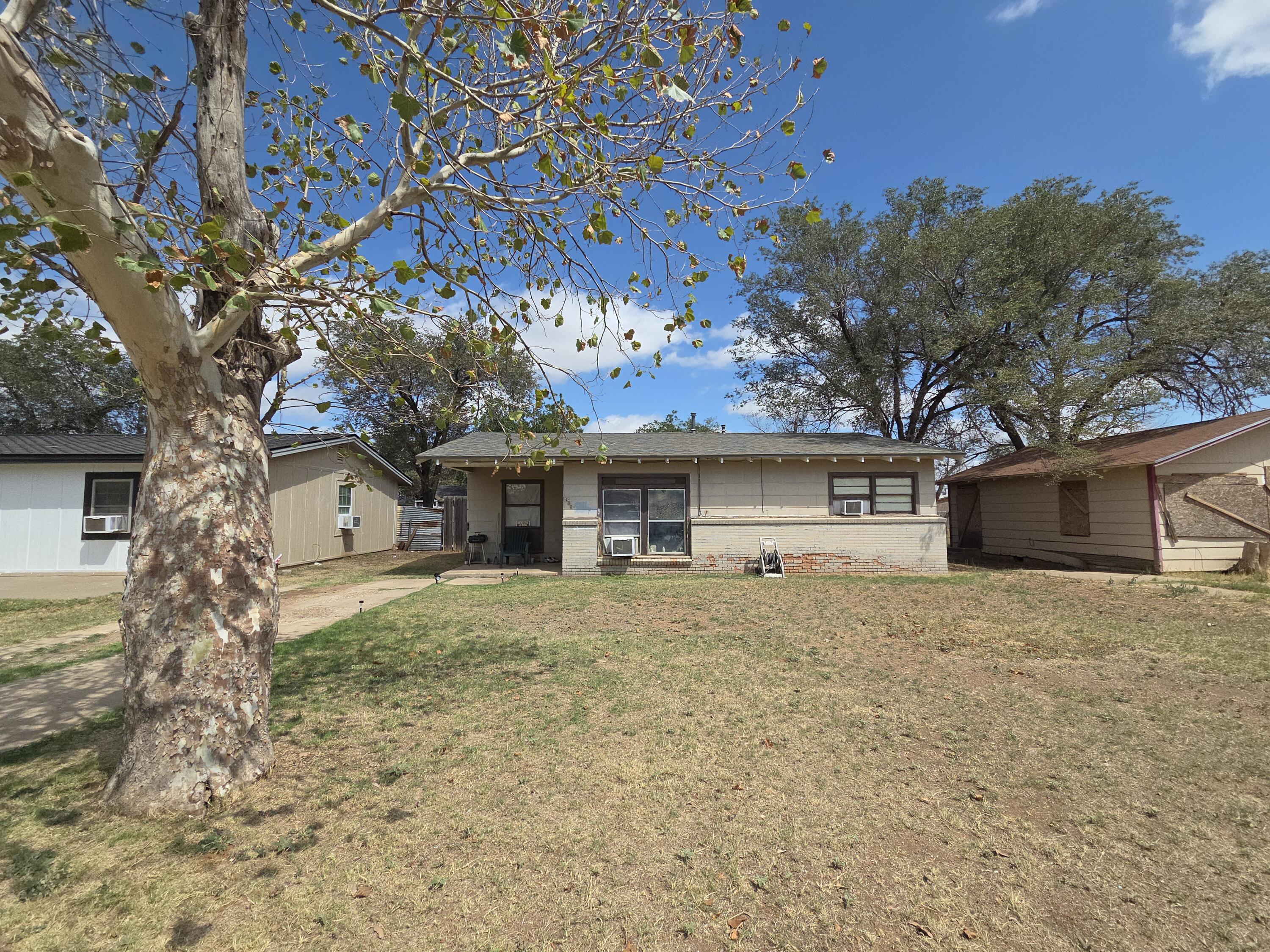 Turn-key St Lubbock Tx 79403 Lubbock, TX 79411 - Photo 16 of 18 a house that has a tree in front of it