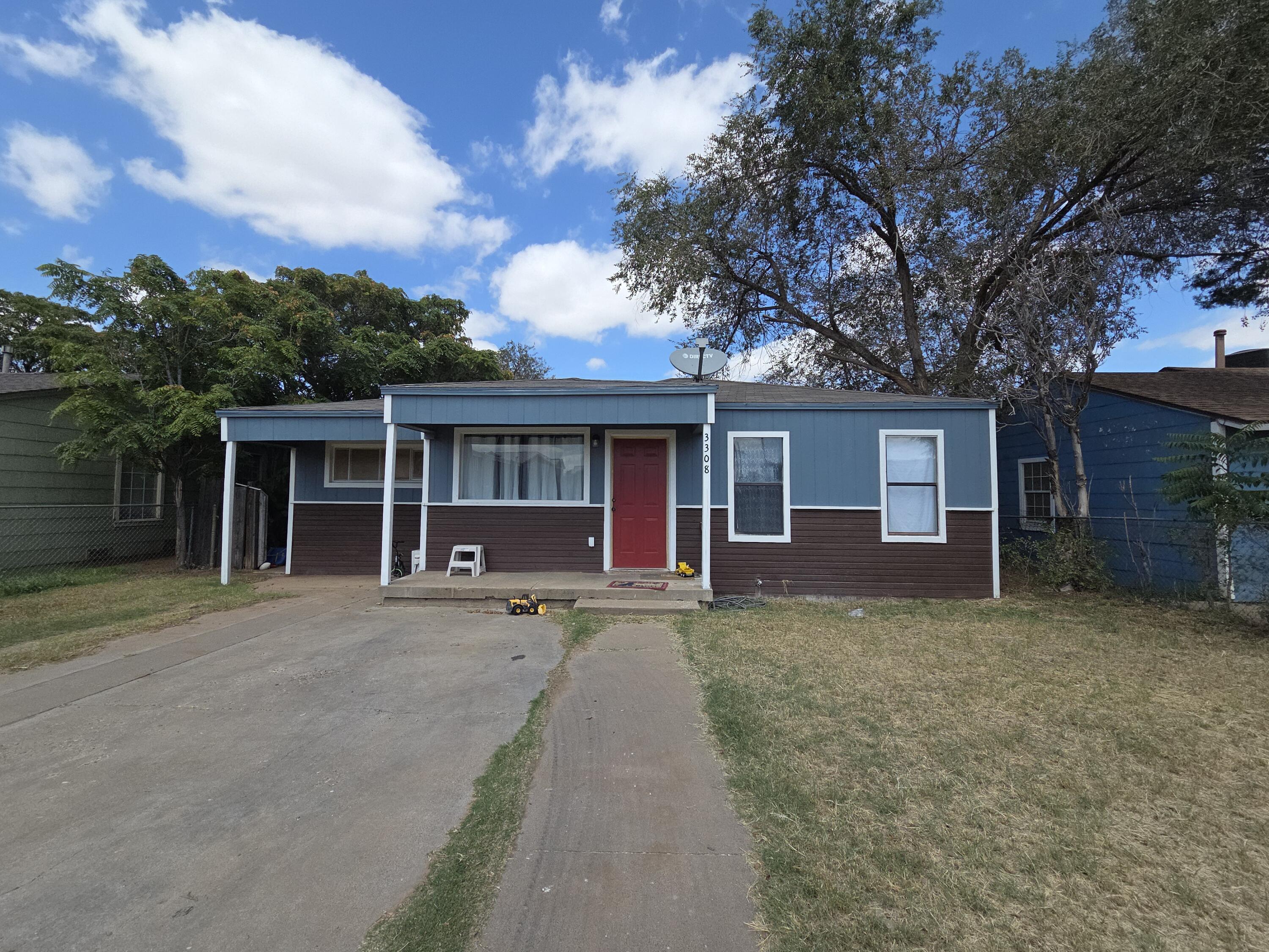 Turn-key St Lubbock Tx 79403 Lubbock, TX 79411 - Photo 5 of 18 front view of a house with a garden and trees