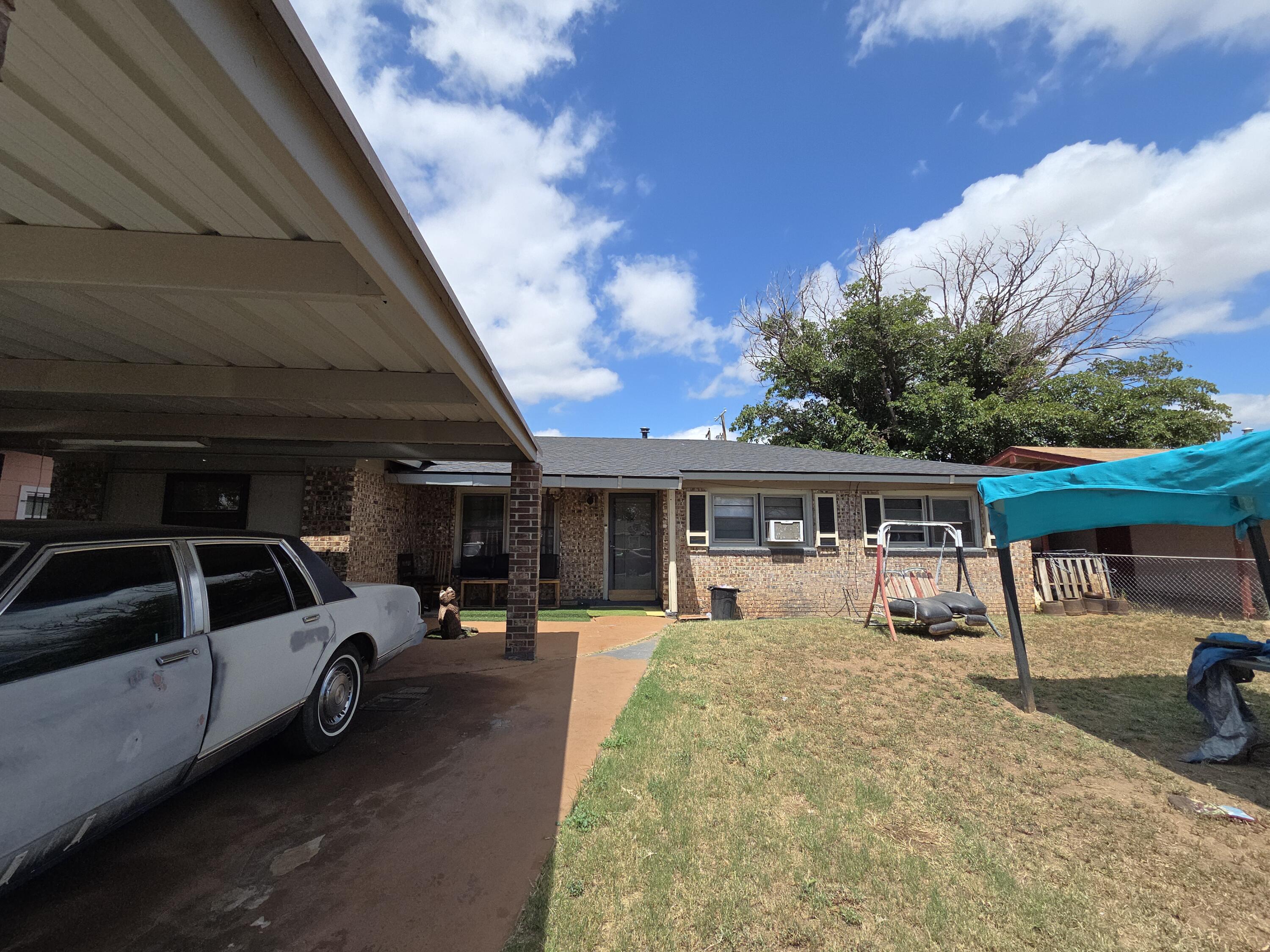 Turn-key St Lubbock Tx 79403 Lubbock, TX 79411 - Photo 6 of 18 a view of a car park in front of house