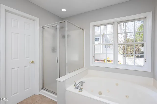 a bathroom with a glass shower door